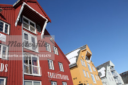 Converted warehouses along harbour front, Tromso, Troms, Norway, Scandinavia, Europe