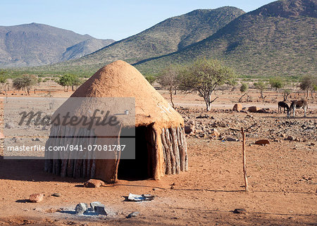 Traditional mud-covered dwelling in a Himba village in the Kunene Region, formerly Kaokoland, in the far north of Namibia, Africa