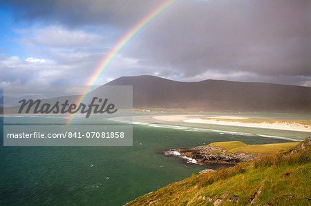 View across the beach at Seilebost towards Luskentyre and the hills of North Harris with a rainbow arching across the scene, Seilebost, Isle of Harris, Outer Hebrides, Scotland, United Kingdom, Europe