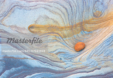 Colourful patterns created by sea erosion on rocks revealed at low tide on Spittal Beach, Berwick-upon-Tweed, Northumberland on border between England and Scotland, United Kingdom, Europe