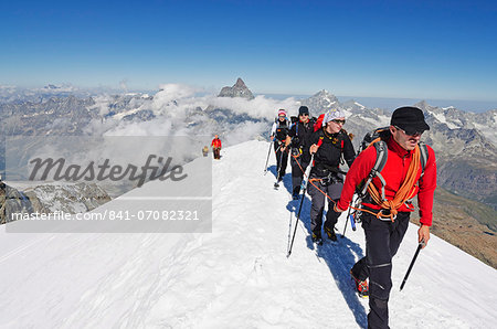 Climbers on Breithorn mountain, 4164m, Matterhorn in background, Zermatt, Valais, Swiss Alps, Switzerland, Europe
