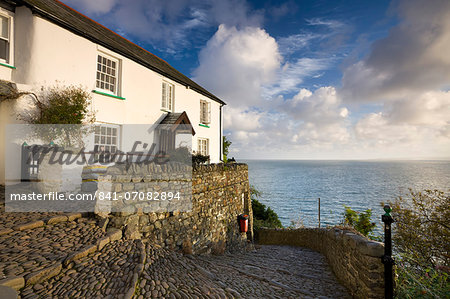 Whitewashed cottage and cobbled lane in the picturesque village of Clovelly, Devon, England, United Kingdom, Europe