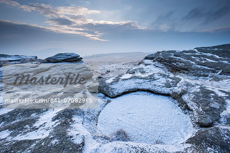 Snow dusted Kes Tor showing Dartmoor's largest rock basin, Dartmoor National Park, Devon, England, United Kingdom, Europe