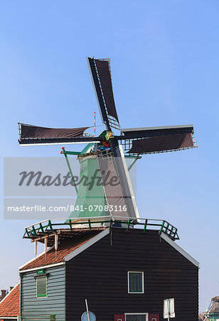 Preserved historic windmills and houses in Zaanse Schans, a village and working museum on the banks of the river Zaan, near Amsterdam, Zaandam, North Holland, Netherlands, Europe