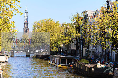 Westerkerk church tower by Prinsengracht canal, Amsterdam, Netherlands, Europe