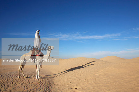 Dromedary rider in the Sahara, Douz, Kebili, Tunisia, North Africa, Africa