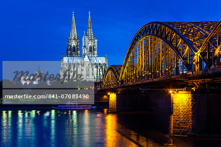 Rhine bridge and Cathedral of Cologne above the River Rhine at night, Cologne, North Rhine-Westphalia, Germany, Europe