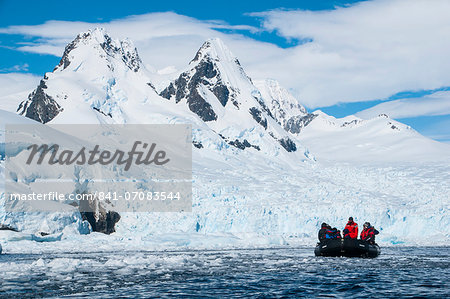 Tourists in a Zodiac in front of glaciers in Cierva Cove, Antarctica, Polar Regions