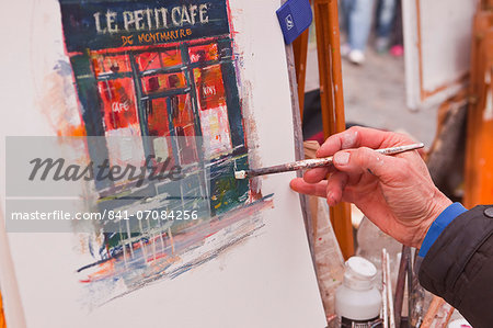 A street artist at work in the famous Place du Tertre in Montmartre, Paris, France, Europe