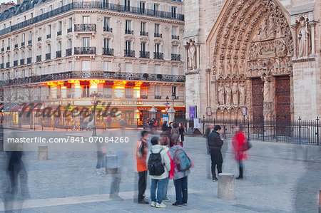 People gathered outside Notre Dame de Paris cathedral, Paris, France, Europe