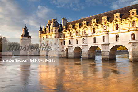 The River Cher and Chateau Chenonceau lit up by the setting sun, Indre-et-Loire, Centre, France, Europe