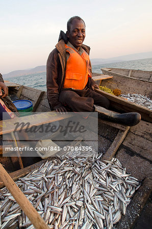 Fisherman on Lake Tanganyika early morning fishing for cichlids to sell in the local fish market, Zambia, Africa