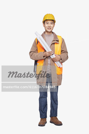 Construction worker holding blueprint against white background, portrait