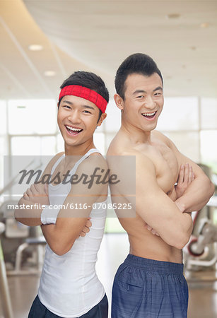 Portrait of two friends at the gym