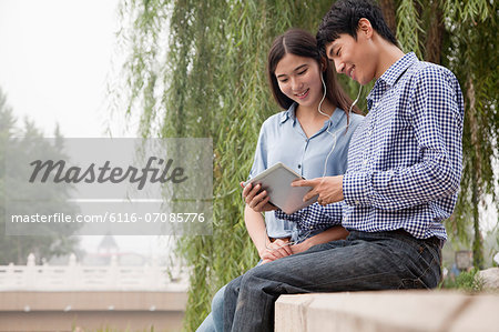 Couple Looking at Tablet Together