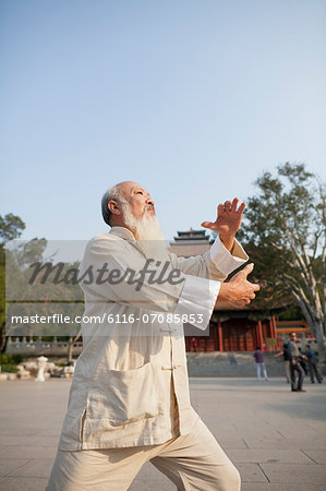 Senior Man Practicing Tai Ji
