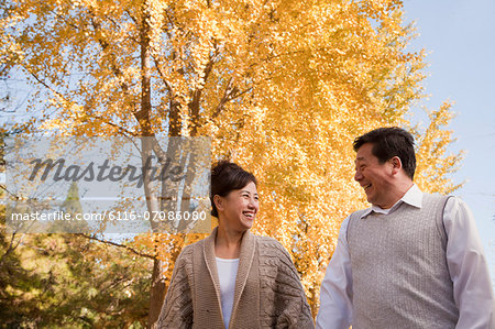 Mature Couple Walking in the Park