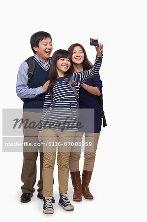 Family taking picture with digital camera