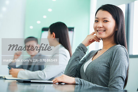 Businesswoman Looking At Camera in a Meeting