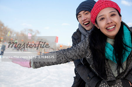 Young couple at ice rink