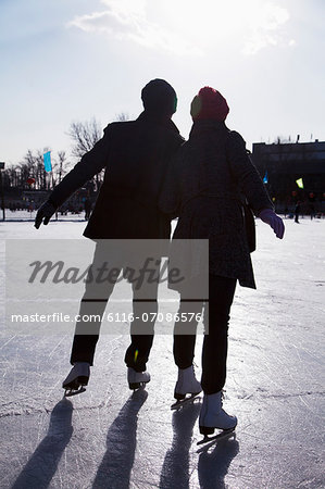 Young couple at ice rink