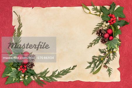 Christmas border with red baubles, holly, mistletoe, ivy, fir leaf sprigs and pinecones over old parchment and red background.