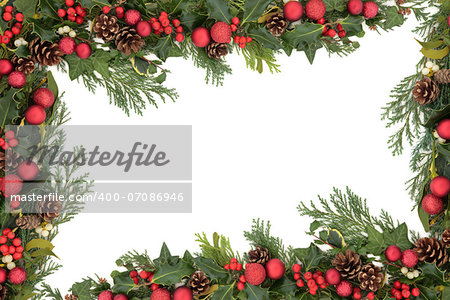 Christmas and winter floral border with red baubles, natural holly, mistletoe, ivy, fir leaf sprigs and pinecones over white background.