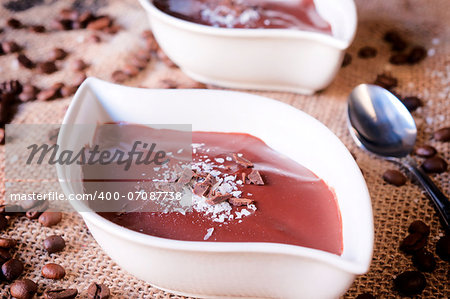 Fresh and homemade chocolate pudding. Selective focus on the crumbles