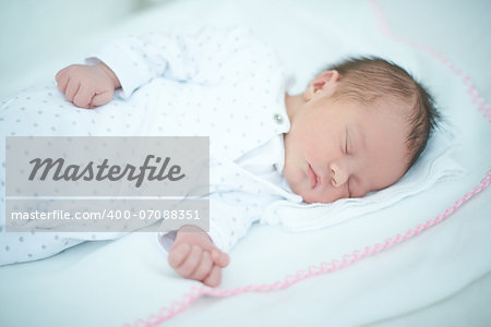 Adorable Caucasian Child Sleeping on White Blanket