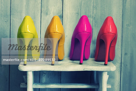 Retro photo of pink, yellow and red shoes