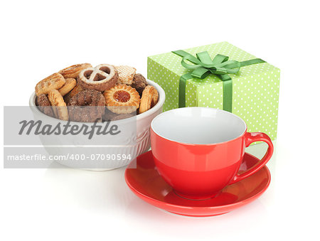 Various cookies, red tea cup and green gift box. Isolated on white background