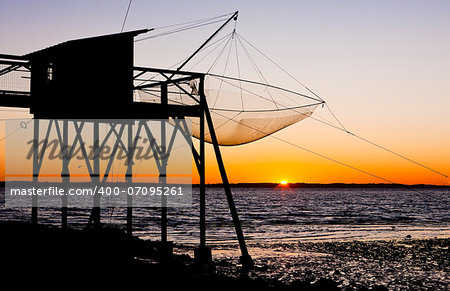 pier with fishing net during sunrise, Gironde Department, Aquitaine, France