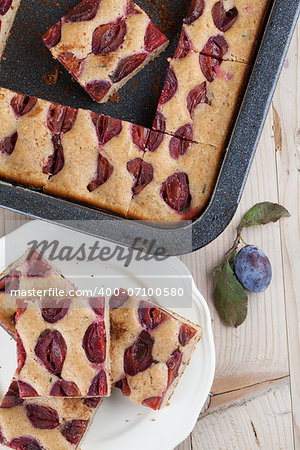 Healthy homemade spelt zucchini cake with plums. Shallow dof