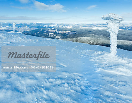 Morning sunny winter mountain landscape and snowbound pillars(Carpathian, Ukraine).