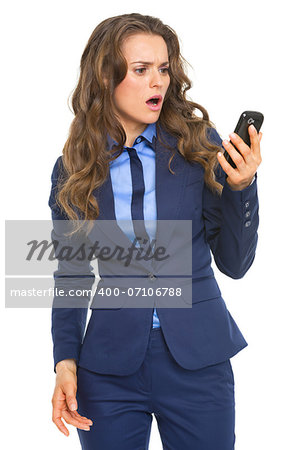 Surprised business woman looking on cell phone