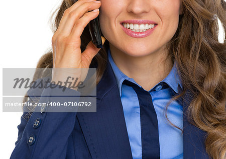 Closeup on happy business woman talking cell phone