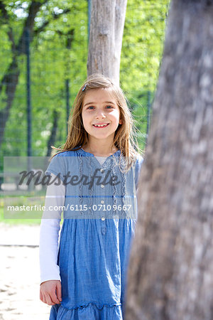 Girl with blond hair in the playground, Munich, Bavaria, Germany