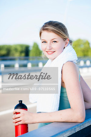 Young Woman with Towel and Water Bottle, Worms, Rhineland-Palatinate, Germany