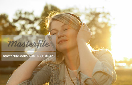 Young Woman Listening to Music with Headphones, Mannehim, Baden-Wurttemberg, Germany