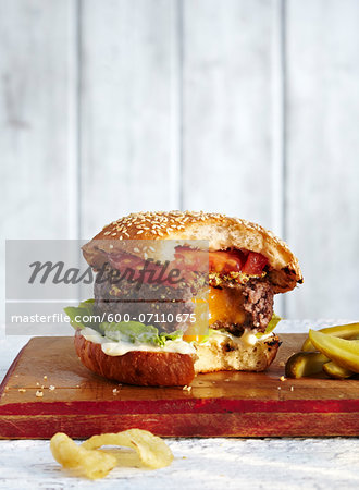 Cheese Filled Hamburger with Bites Taken, Studio Shot