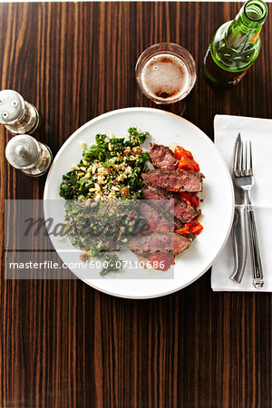 Overhead View of Steak with Vegetables and Beer, Studio Shot Overhead View of Steak with Vegetables and Beer, Studio Shot