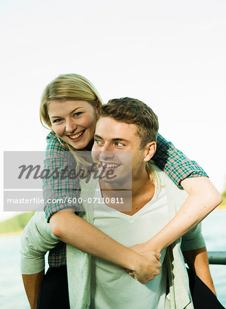 Young Man giving Young Woman Piggyback Ride, Mannheim, Baden-Wurttermberg, Germany