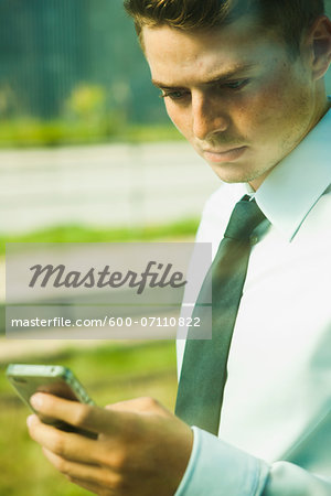 Close-up of Businessman using Cell Phone, Mannheim, Baden-Wurttermberg, Germany
