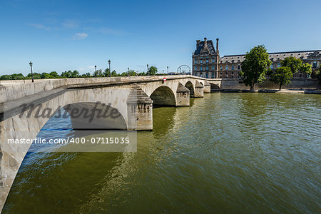 View of Louvre Palace and Pont Royal in Paris, France