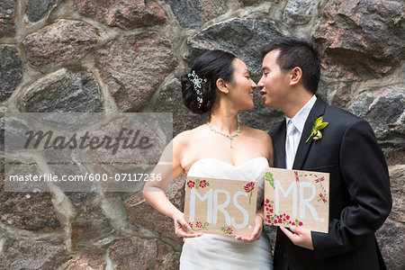 Portrait of Married Couple with Mr and Mrs Signs Portrait of Married Couple with Mr and Mrs Signs