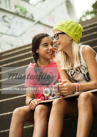 Girls Sitting on Steps with Skateboard, Mannheim, Baden-Wurttemberg, Germany Girls Sitting on Steps with Skateboard, Mannheim, Baden-Wurttemberg, Germany