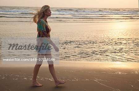 Woman walking on beach Woman walking on beach