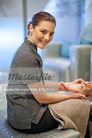 Portrait of masseur in spa treatment room
