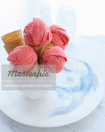 Bowl of ice cream cones filled with strawberry ice cream Bowl of ice cream cones filled with strawberry ice cream