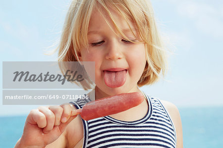 Child about to lick ice lolly Child about to lick ice lolly